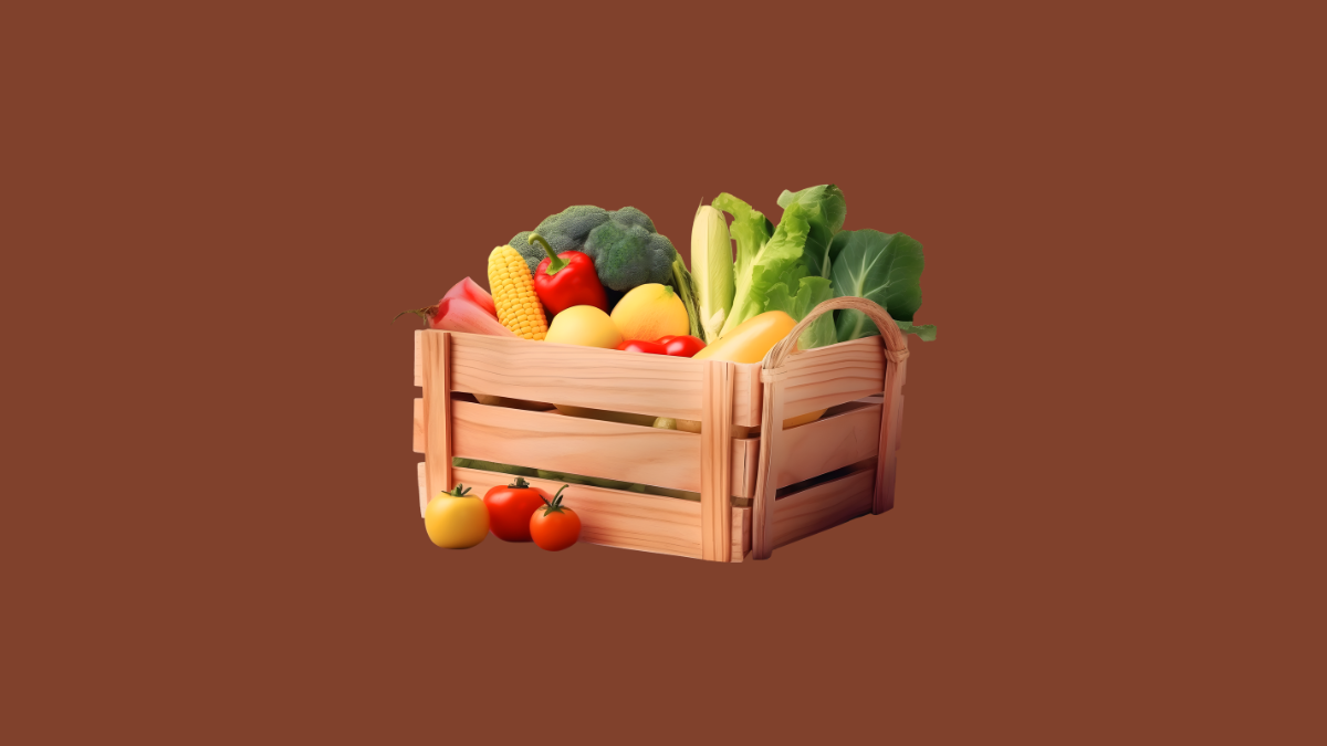 A kitchen counter displaying a colorful assortment of fresh, low-calorie foods like apples, broccoli, and spinach.