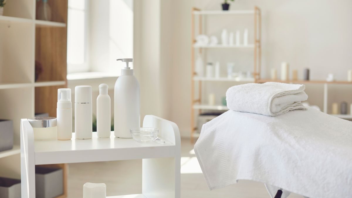 A clean, modern skincare laboratory with small bottles and ingredients on tables, ready for production.